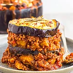 Cozy Mediterranean Eggplant Beef Casserole: The Ultimate Low-Carb Comfort Dish A close-up of the golden, baked casserole with distinct layers of eggplant and meat sauce, ready to serve.
