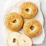 The Ultimate Chewy Keto Bagel Recipe: Garlic-Infused & 5 Ingredients The bagel after baking covered with sesame seeds, displaying a cut slice that reveals its fluffy, ready-to-eat internal texture.