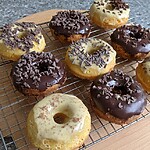 Fluffy Keto Donuts: The Low-Carb Baked Treat That Actually Tastes Real Freshly baked donuts cooling on a wire rack, drizzled with glossy dark and white chocolate glazes