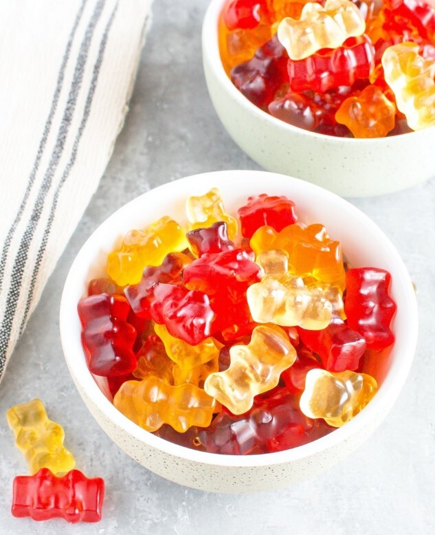 Image of the final result after shaping and drying, gelatin gummy bears ready to serve in bowls.