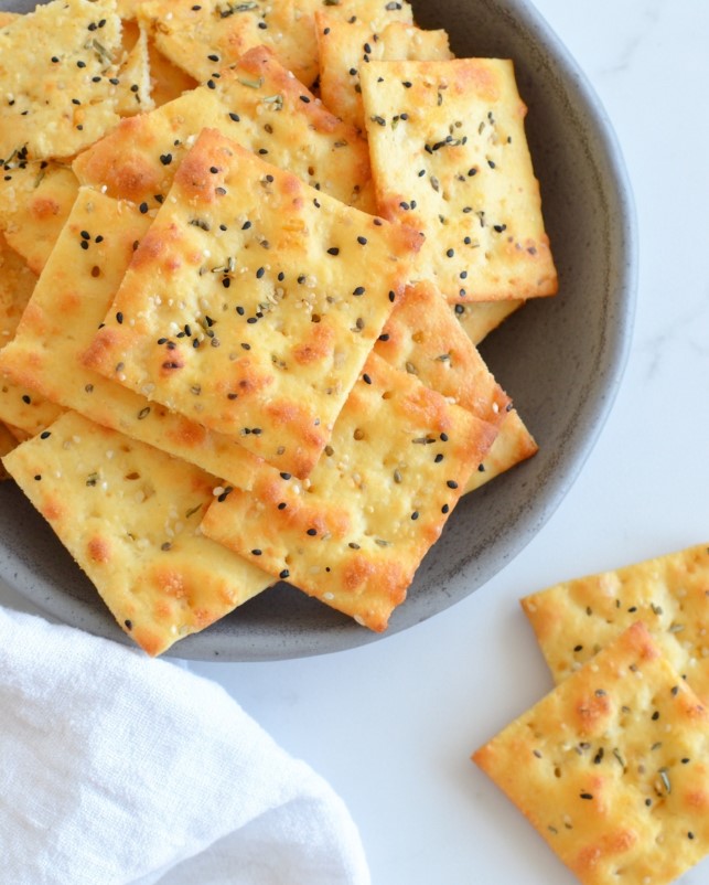 Crispy cooled crackers arranged on a platter, ready for snacking or dipping.