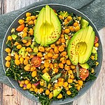 Zesty Keto Mediterranean Bean Salad with Avocado: A Low-Carb Lunch Hack Ready-to-serve bean and vegetable salad after mixing ingredients, seasoning, and garnishing with avocado slices.