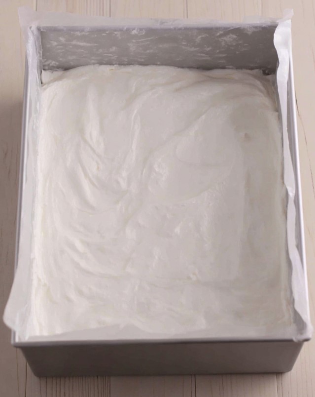 Keto Marshmallow Bars - smooth white marshmallow base layer spread evenly in a lined square pan