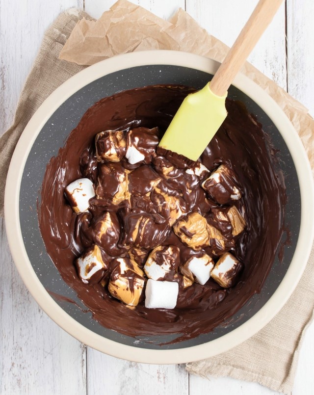 Low carb peanut butter chocolate mixture - process shot of stirring marshmallows and butter into melted chocolate